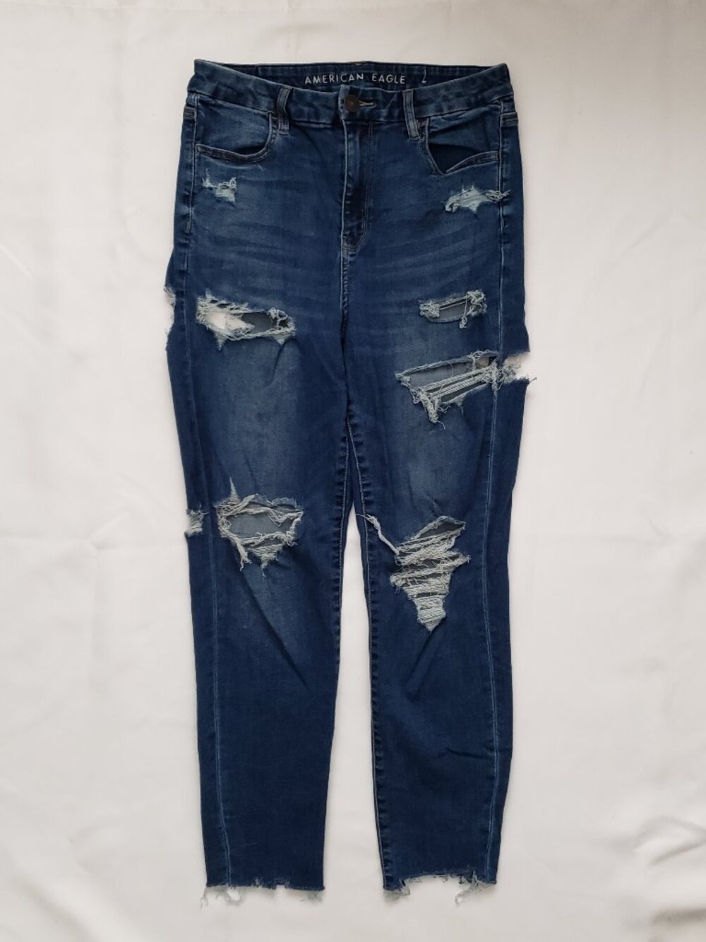 American Eagle Curvy high rise jegging size 10 jean heavy distressed rip raw hem